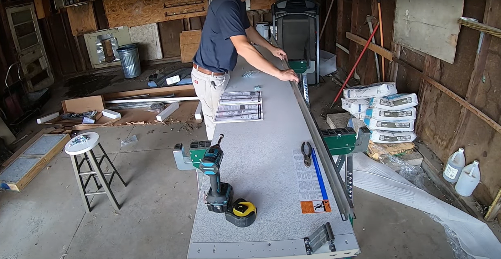 Damaged garage door section being repaired by Parrish Garage Door Repair experts.