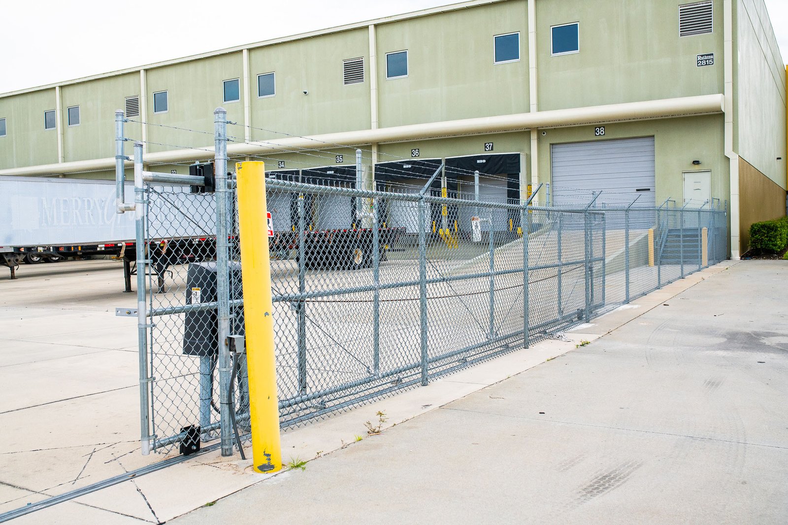 Professional technicians performing commercial gate repair services by Parrish Garage Door Repair